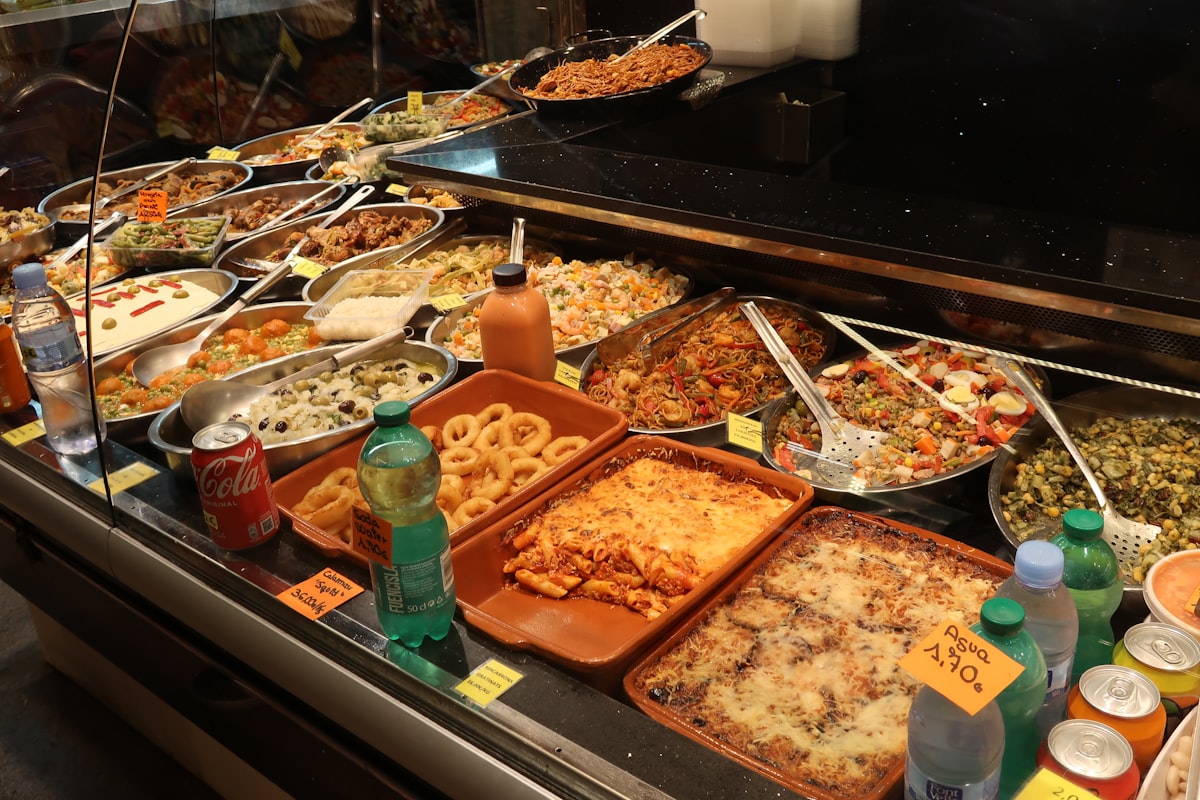 Assorted prepared meals and salads displayed in a food counter